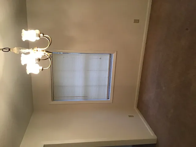 a bathroom with a shower and a sink