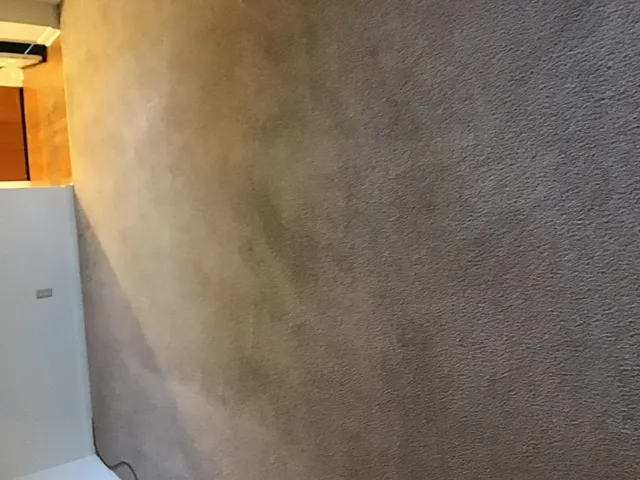 a close view of curtain with wooden floor