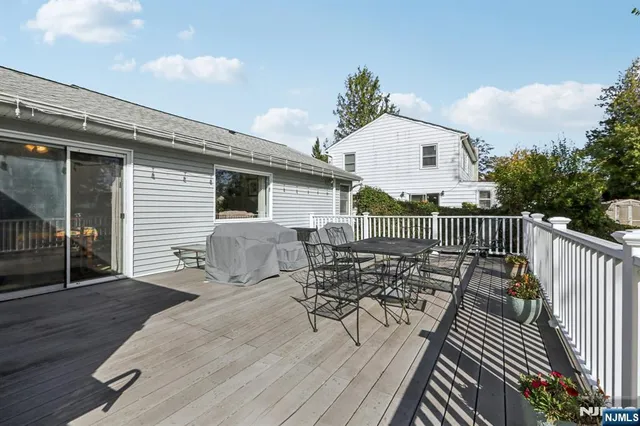 a view of deck with wooden floor and seating space
