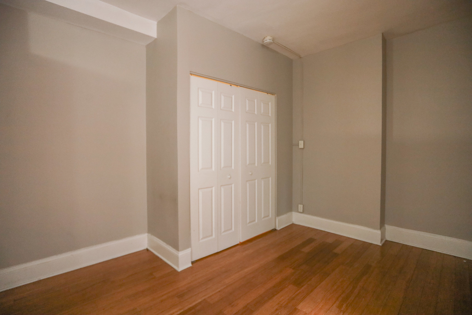 5326 South Cornell Avenue, Unit 314 Chicago, IL 60615 - Photo 5 of 11 a view of an empty room with wooden floor