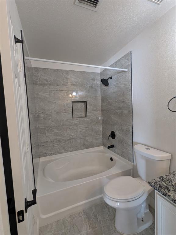 1538 Algonkin Loop Orlando, FL 32828 - Photo 19 of 48 a bathroom with a toilet and a tub
