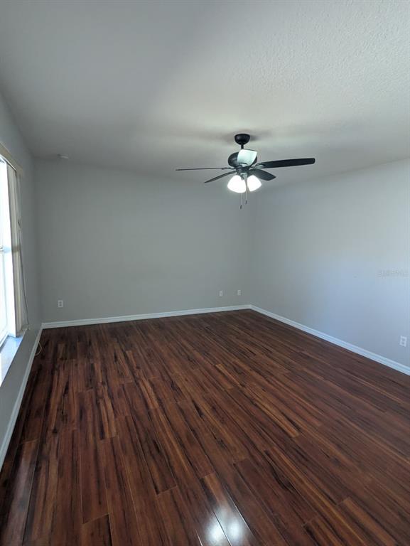 1538 Algonkin Loop Orlando, FL 32828 - Photo 21 of 48 a view of a room with wooden floor and fan