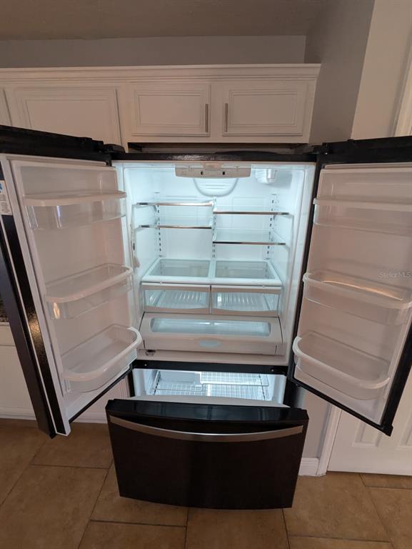 1538 Algonkin Loop Orlando, FL 32828 - Photo 25 of 48 a refrigerator in a kitchen
