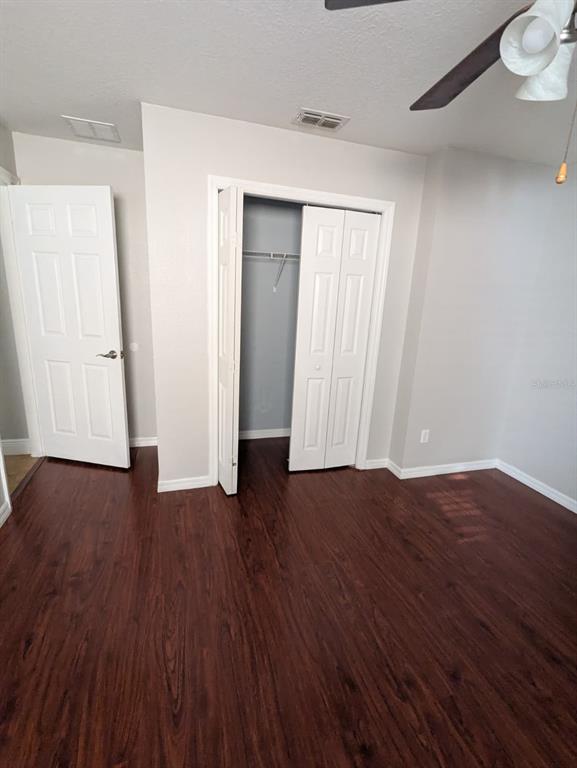 1538 Algonkin Loop Orlando, FL 32828 - Photo 32 of 48 a view of an empty room with wooden floor and closet