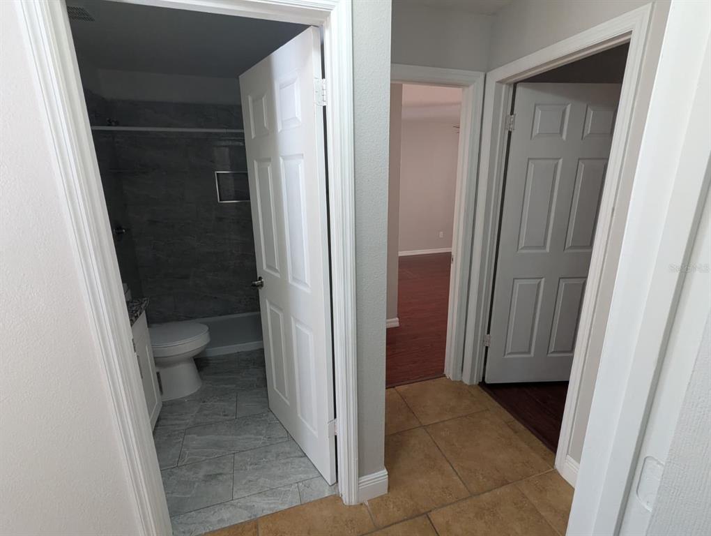 1538 Algonkin Loop Orlando, FL 32828 - Photo 36 of 48 a view of bathroom with a toilet and a sink