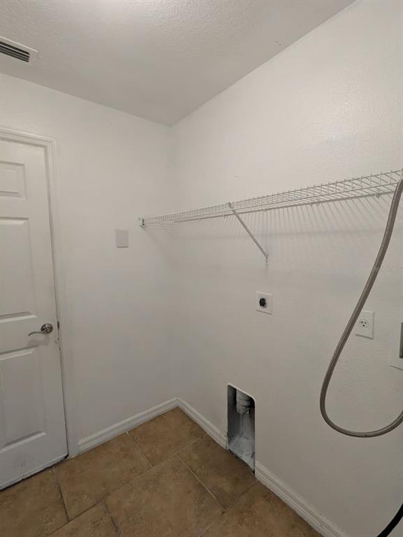 1538 Algonkin Loop Orlando, FL 32828 - Photo 40 of 48 a view of a room with racks on the wall