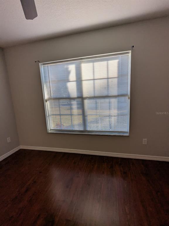 1538 Algonkin Loop Orlando, FL 32828 - Photo 46 of 48 a view of wooden floor and a window in a room