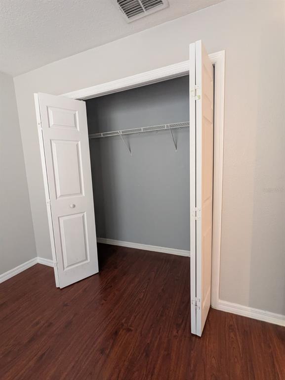 1538 Algonkin Loop Orlando, FL 32828 - Photo 47 of 48 an empty room with wooden floor and closet