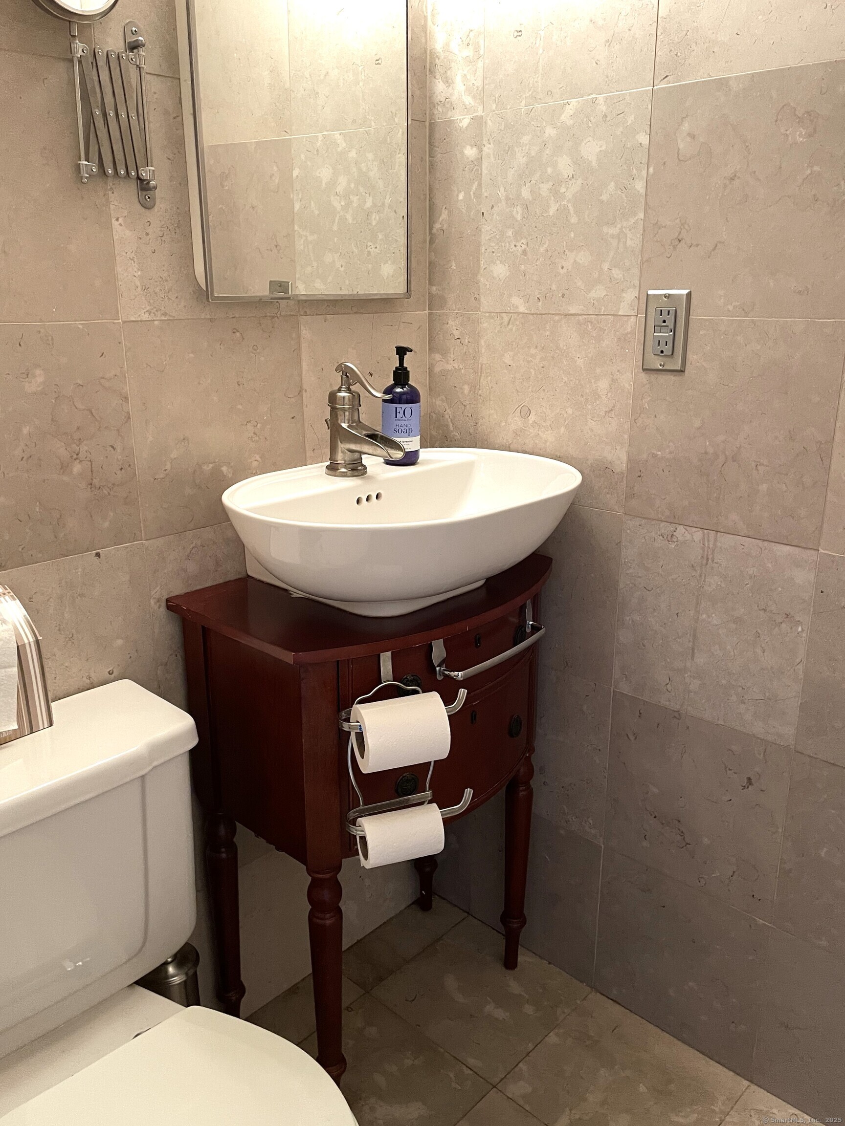 124 Court Street, Unit 502 New Haven, CT 06510 - Photo 4 of 8 a bathroom with a sink toilet and a mirror