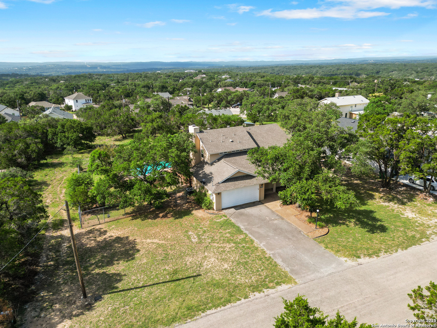 890 Live Oak Drive Spring Branch, TX 78070 - Photo 1 of 49 an aerial view of a house with a yard