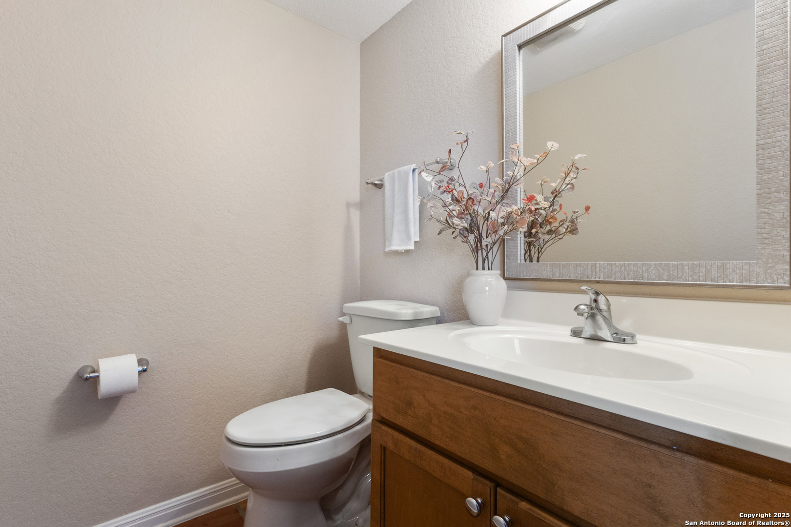 890 Live Oak Drive Spring Branch, TX 78070 - Photo 15 of 49 a bathroom with a sink toilet and a mirror