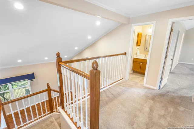 a view of a hallway with staircase