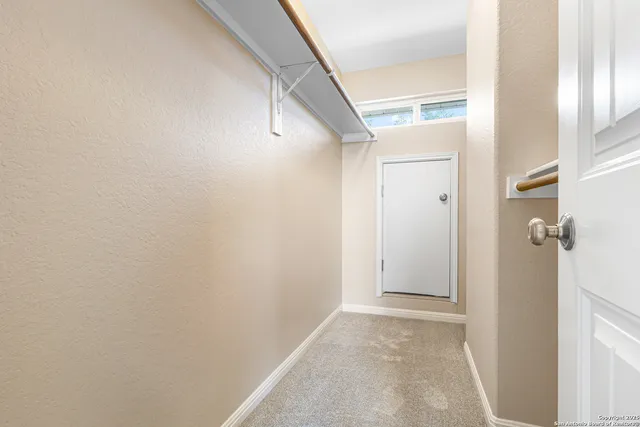 a view of a hallway with closet
