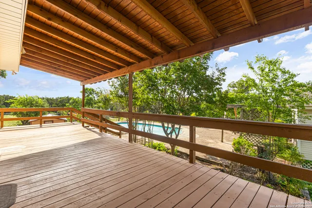 a view of balcony with wooden floor