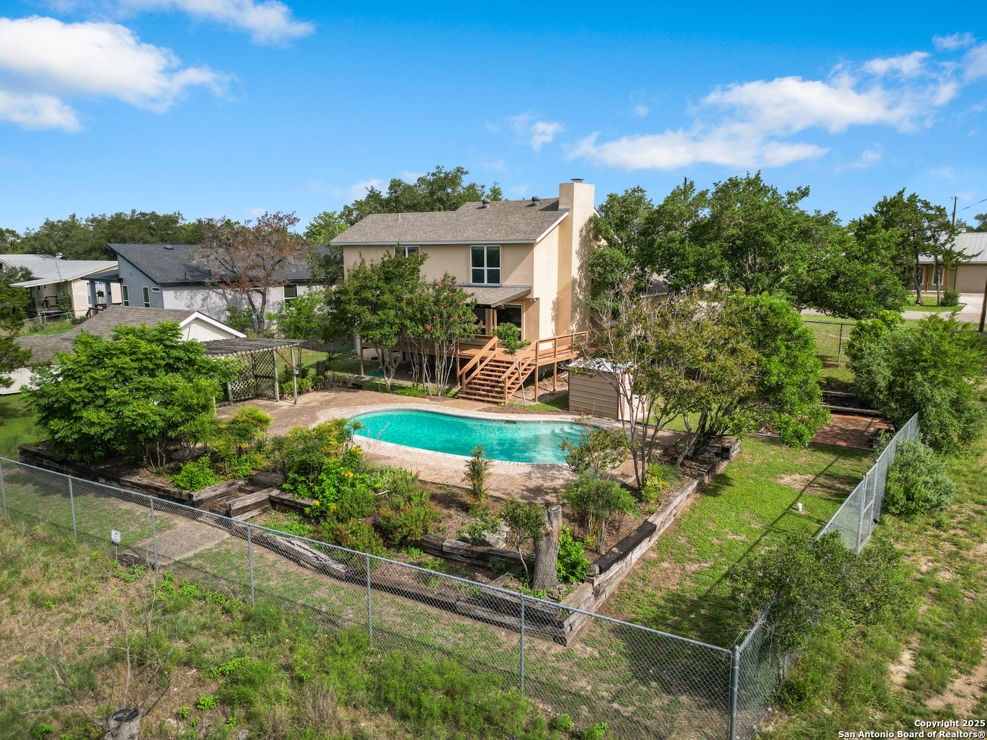 890 Live Oak Drive Spring Branch, TX 78070 - Photo 37 of 49 a view of a house with a yard and potted plants