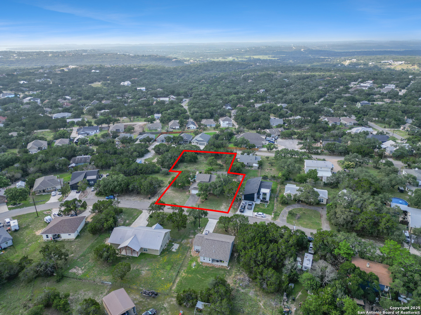 890 Live Oak Drive Spring Branch, TX 78070 - Photo 39 of 49 an aerial view of residential houses with outdoor space and trees