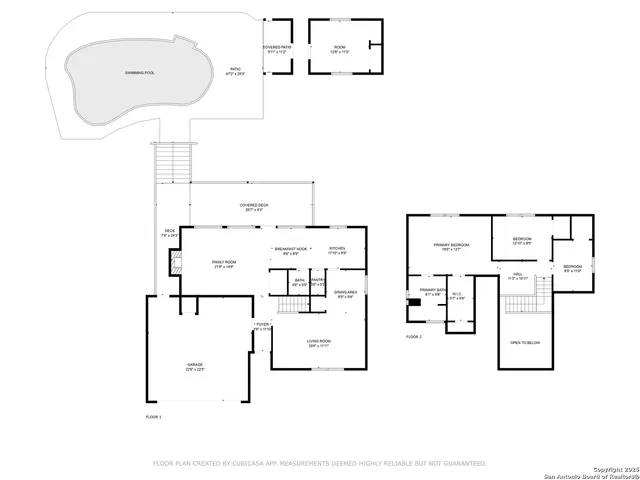 an aerial view of a house with a yard and outdoor seating
