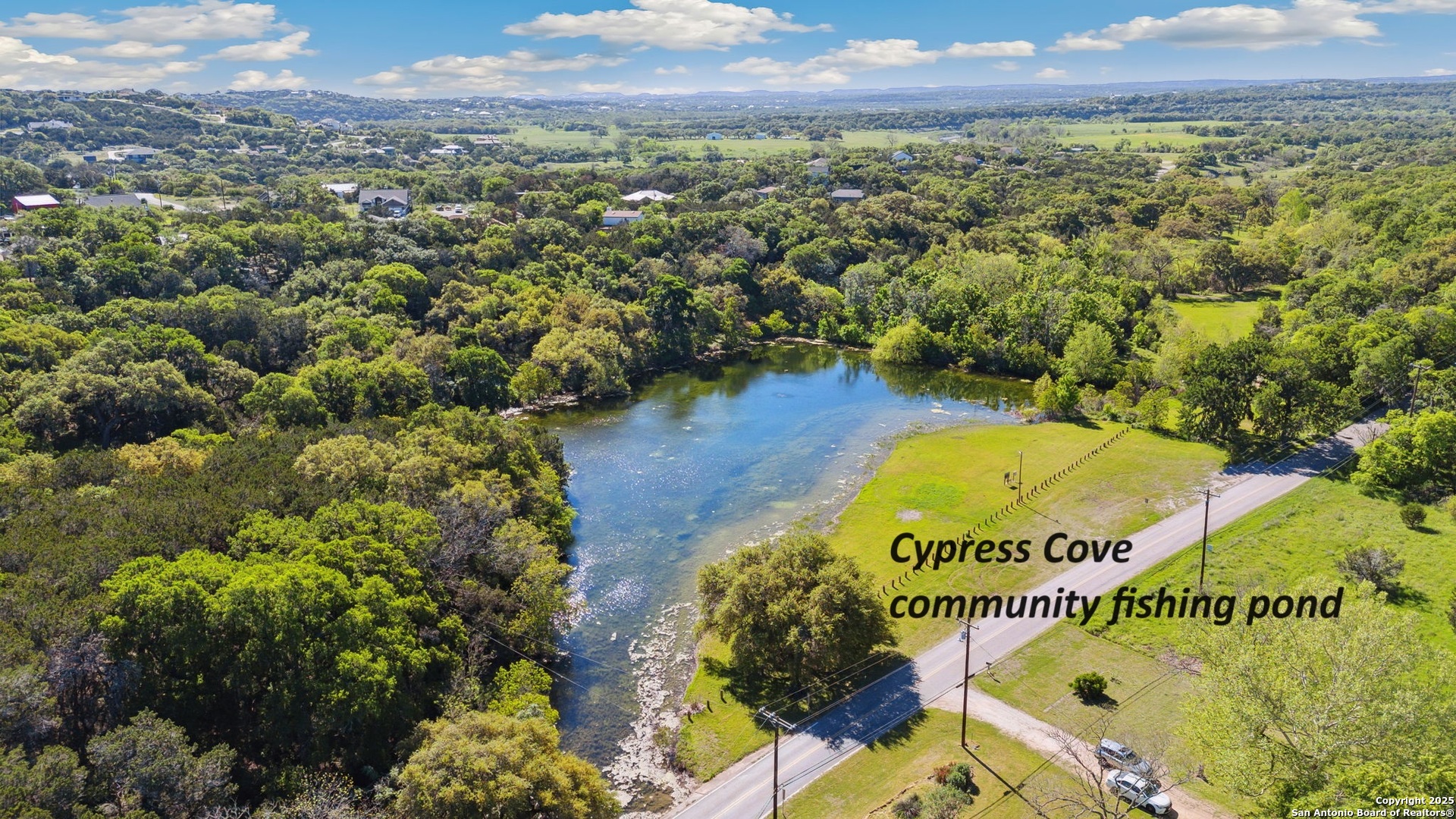 890 Live Oak Drive Spring Branch, TX 78070 - Photo 47 of 49 a view of a swimming pool with a garden and mountain view