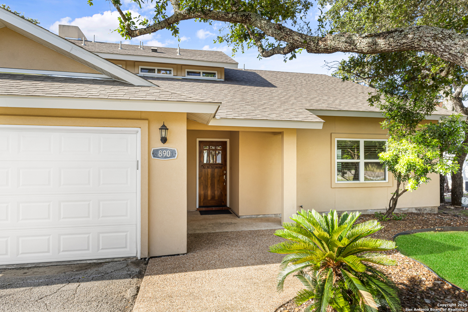 890 Live Oak Drive Spring Branch, TX 78070 - Photo 6 of 49 a front view of a house with a yard