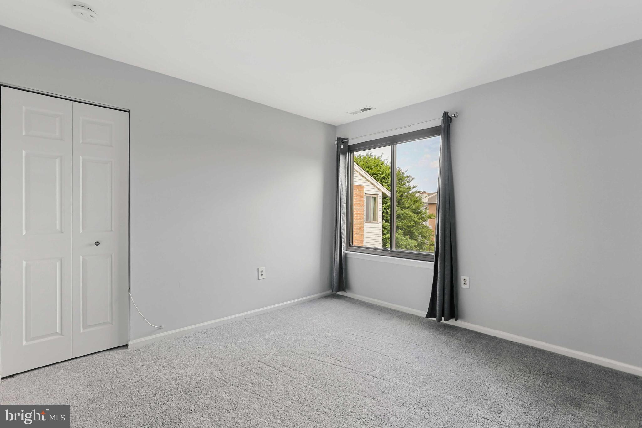 1110 Castle Harbor Way, Unit 3D Glen Burnie, MD 21060 - Photo 15 of 30 a view of an empty room with a window