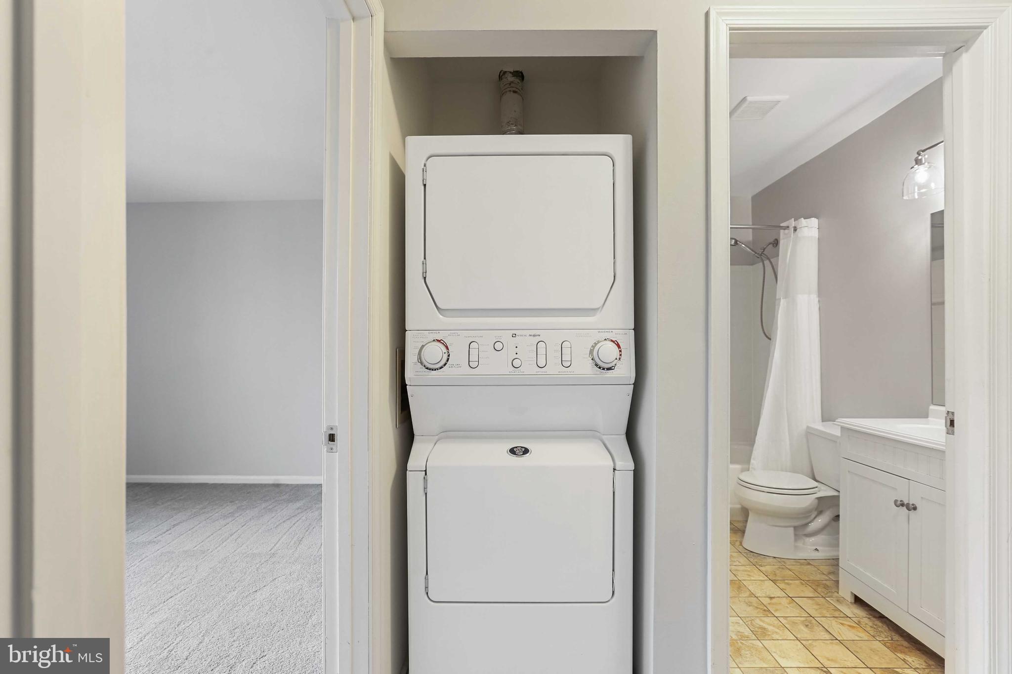 1110 Castle Harbor Way, Unit 3D Glen Burnie, MD 21060 - Photo 24 of 30 a utility room with dryer and washer