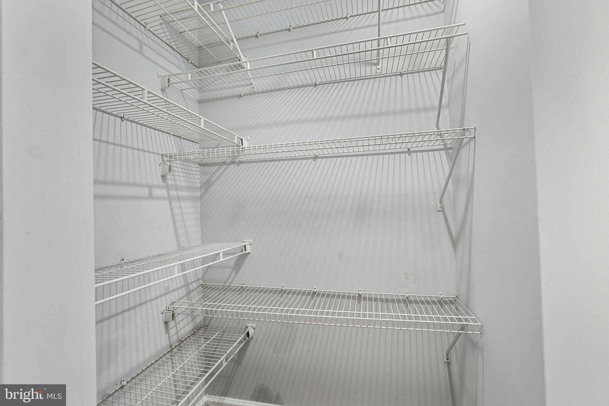 1110 Castle Harbor Way, Unit 3D Glen Burnie, MD 21060 - Photo 25 of 30 a view of walk in closet with empty racks