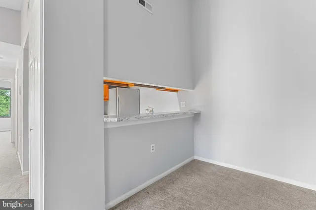 a kitchen with a sink a stove and a refrigerator