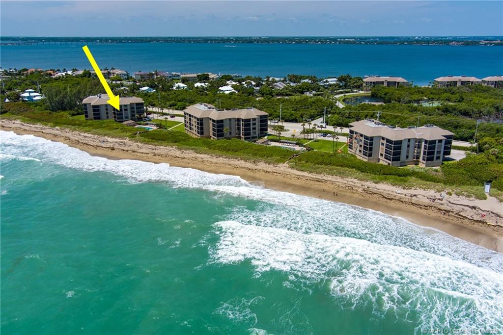 2491 Northeast Ocean Boulevard, Unit 302 Stuart, FL 34996 - Photo 1 of 35 an aerial view of residential houses with outdoor space and ocean view