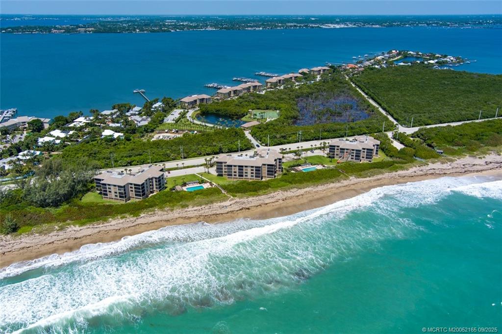 2491 Northeast Ocean Boulevard, Unit 302 Stuart, FL 34996 - Photo 12 of 35 an aerial view of a house with a garden and lake view