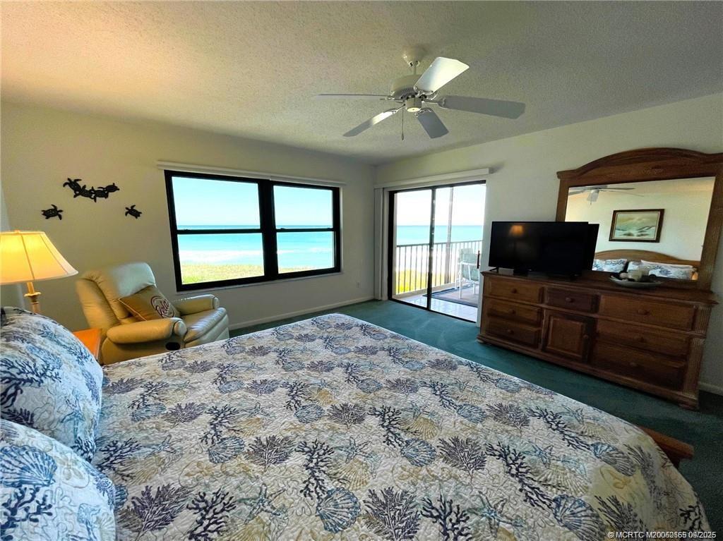 2491 Northeast Ocean Boulevard, Unit 302 Stuart, FL 34996 - Photo 17 of 35 a bedroom with a bed and window
