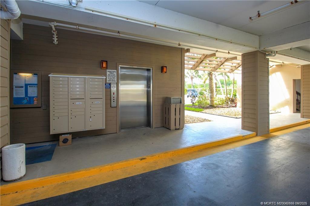 2491 Northeast Ocean Boulevard, Unit 302 Stuart, FL 34996 - Photo 22 of 35 a view of an empty room with wooden floor and a window