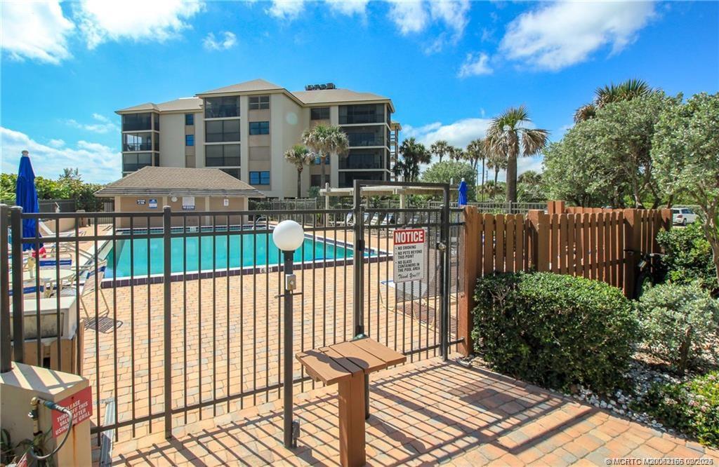2491 Northeast Ocean Boulevard, Unit 302 Stuart, FL 34996 - Photo 24 of 35 a front view of a house with a patio