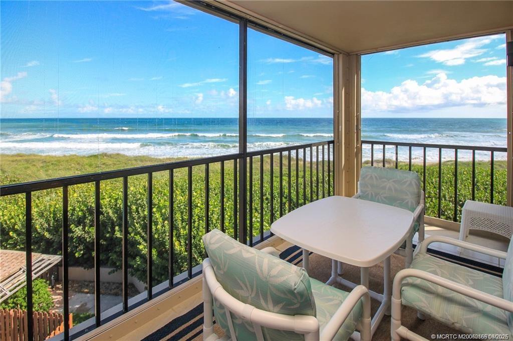 2491 Northeast Ocean Boulevard, Unit 302 Stuart, FL 34996 - Photo 10 of 35 a view of a city from a dining room with large windows