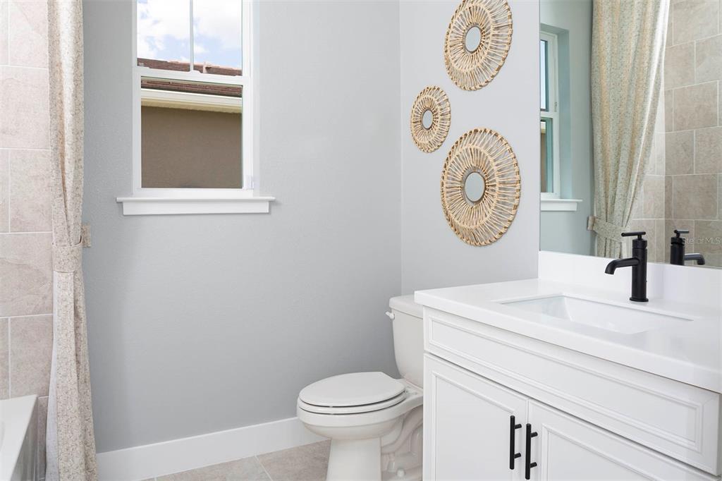 17787 Stillness Court Venice, FL 34293 - Photo 3 of 36 a bathroom with a toilet and a sink