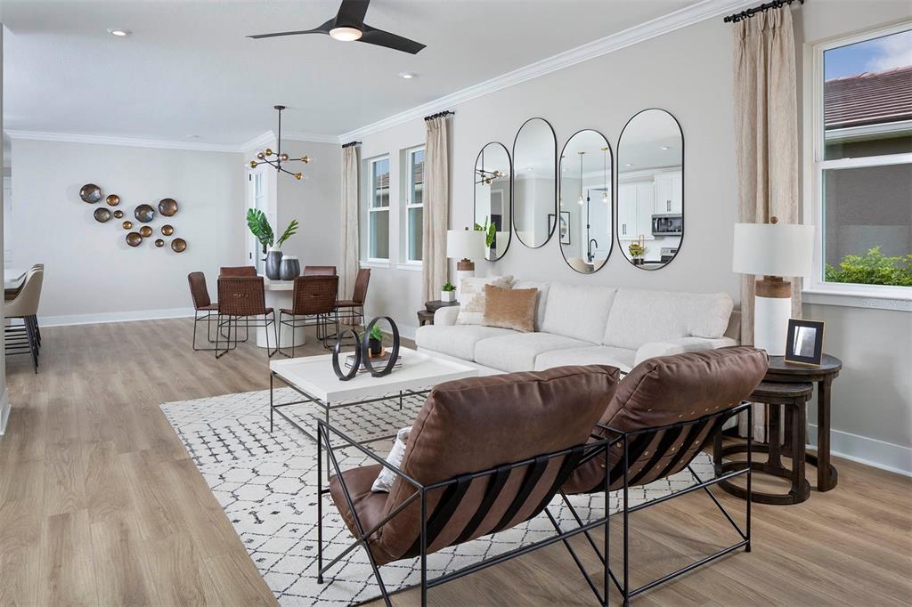 17787 Stillness Court Venice, FL 34293 - Photo 8 of 36 a view of a dining room with furniture window and wooden floor