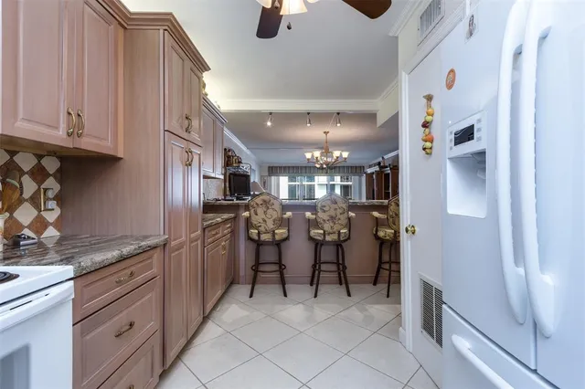 a kitchen with stainless steel appliances granite countertop a sink and cabinets