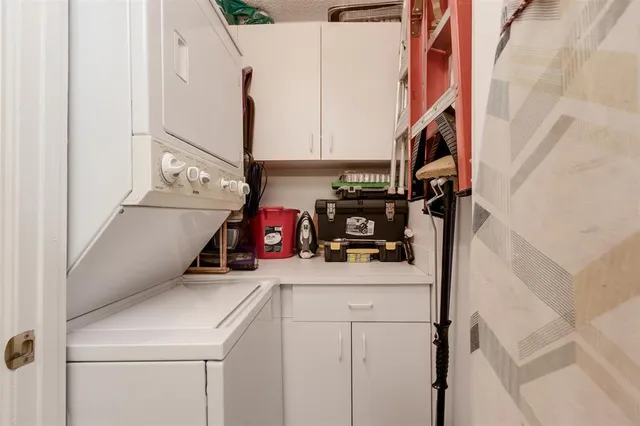 a bathroom with a granite countertop toilet a sink and a mirror