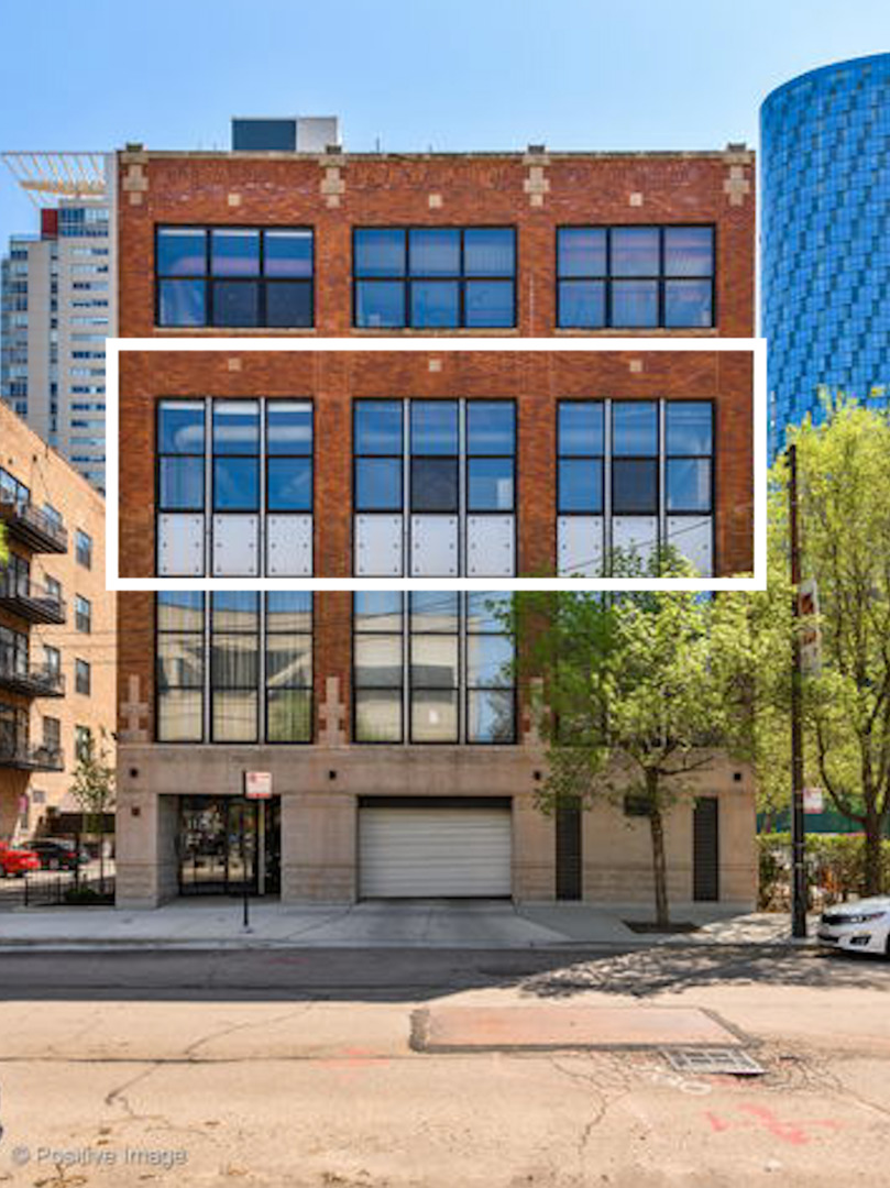 a front view of a building with glass windows and door