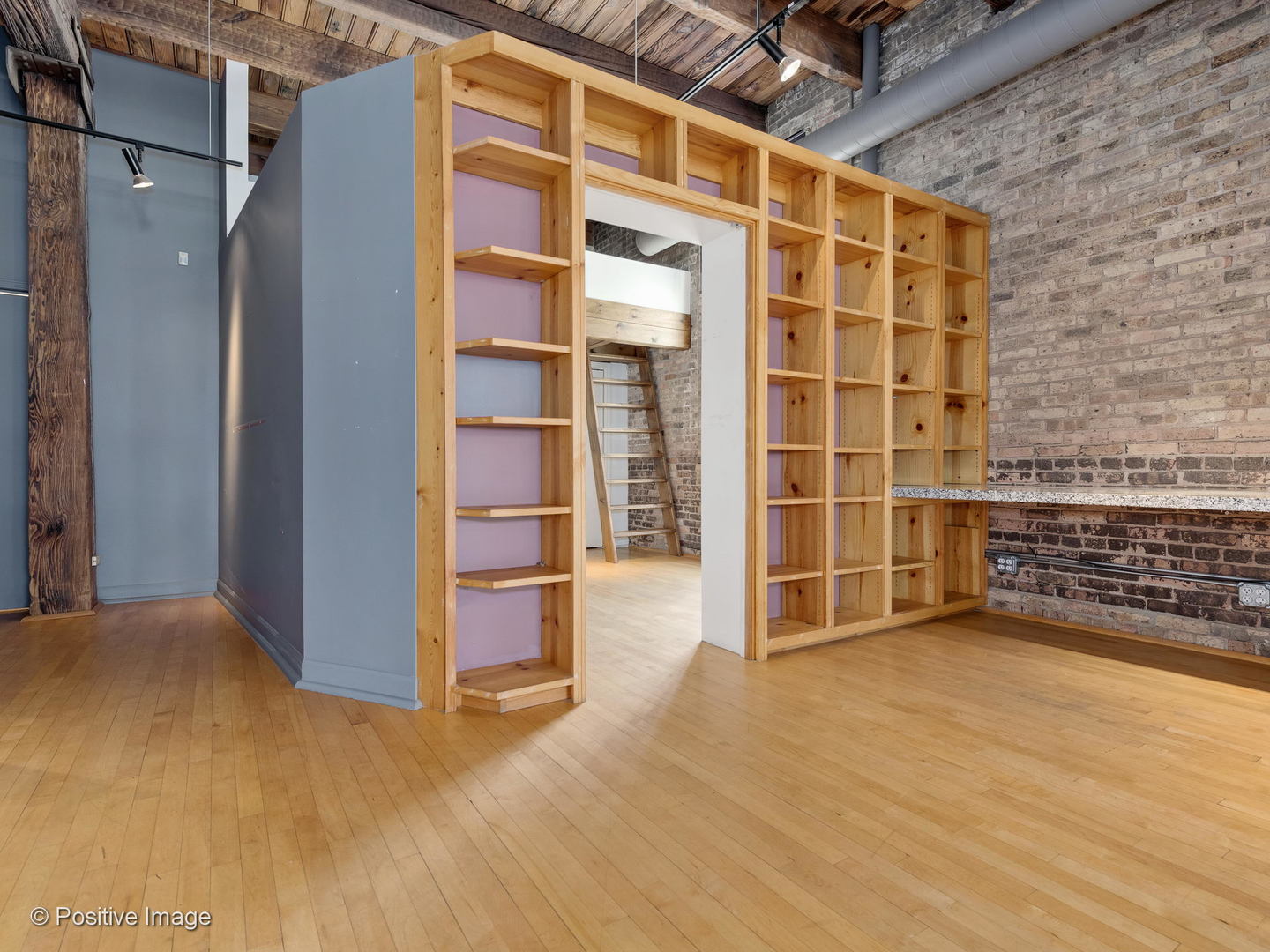 11 North Green Street, Unit 3CD Chicago, IL 60607 - Photo 12 of 40 a view of an empty room with wooden floor and a cabinet