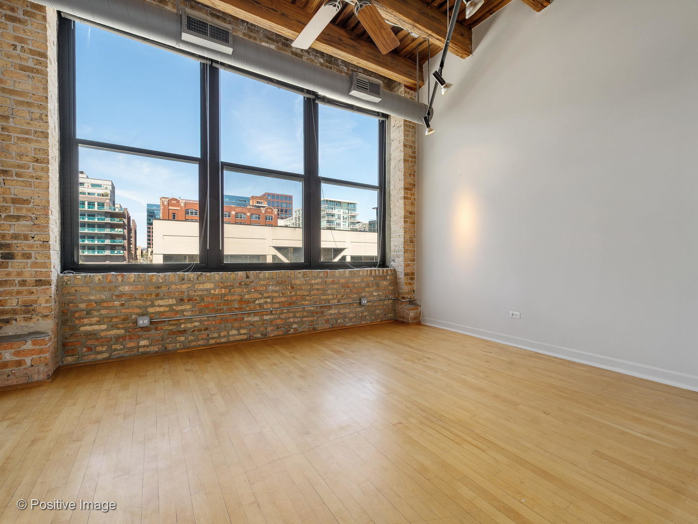 11 North Green Street, Unit 3CD Chicago, IL 60607 - Photo 15 of 40 an empty room with wooden floor and windows