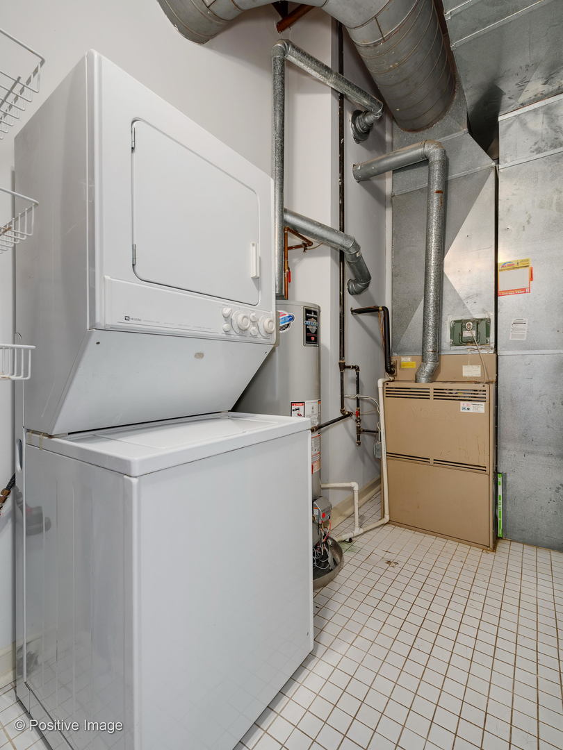 11 North Green Street, Unit 3CD Chicago, IL 60607 - Photo 21 of 40 a utility room with dryer and washer