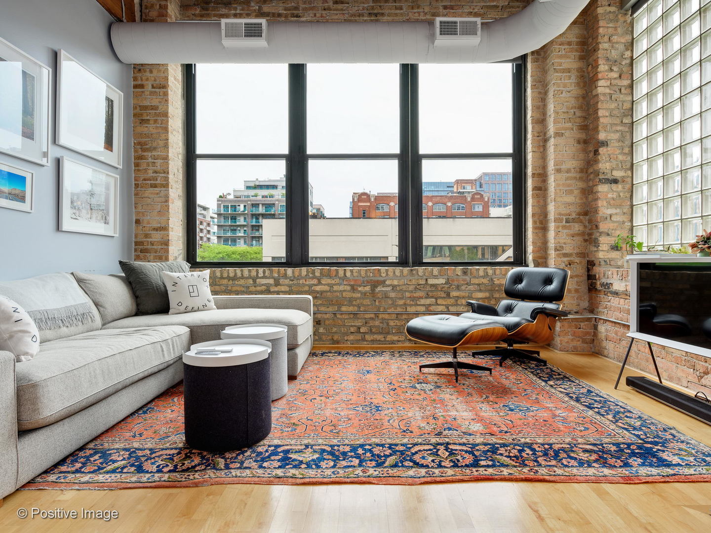 11 North Green Street, Unit 3CD Chicago, IL 60607 - Photo 24 of 40 a living room with furniture a rug and a floor to ceiling window