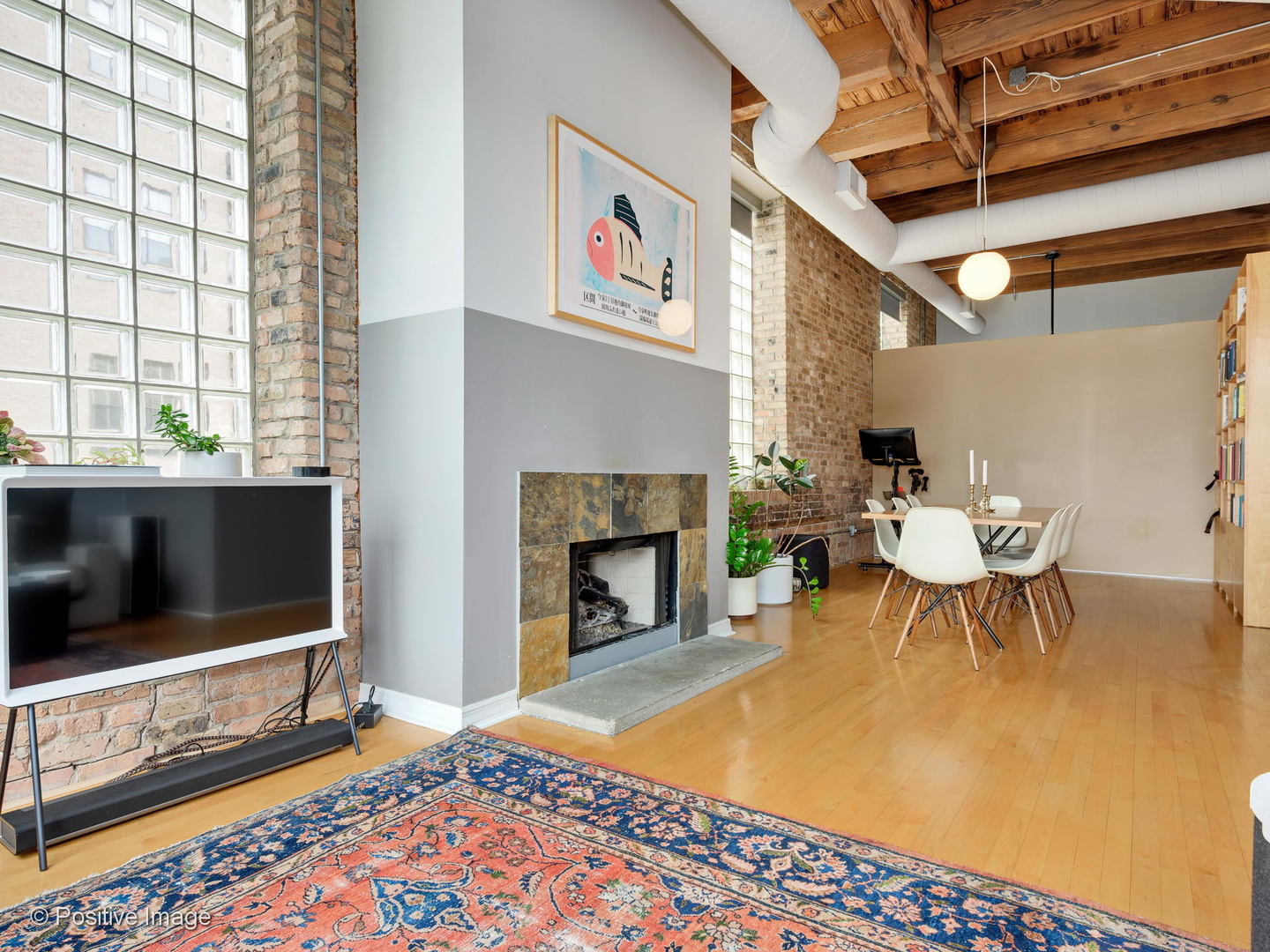 11 North Green Street, Unit 3CD Chicago, IL 60607 - Photo 27 of 40 a living room with furniture a flat screen tv and a fireplace