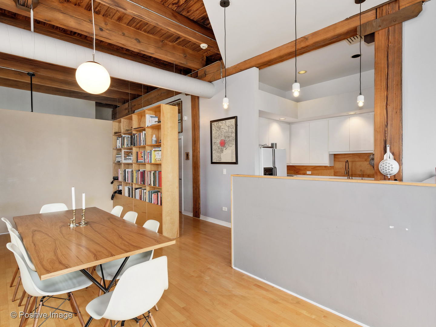 11 North Green Street, Unit 3CD Chicago, IL 60607 - Photo 28 of 40 a kitchen with stainless steel appliances kitchen island granite countertop a table chairs and a refrigerator