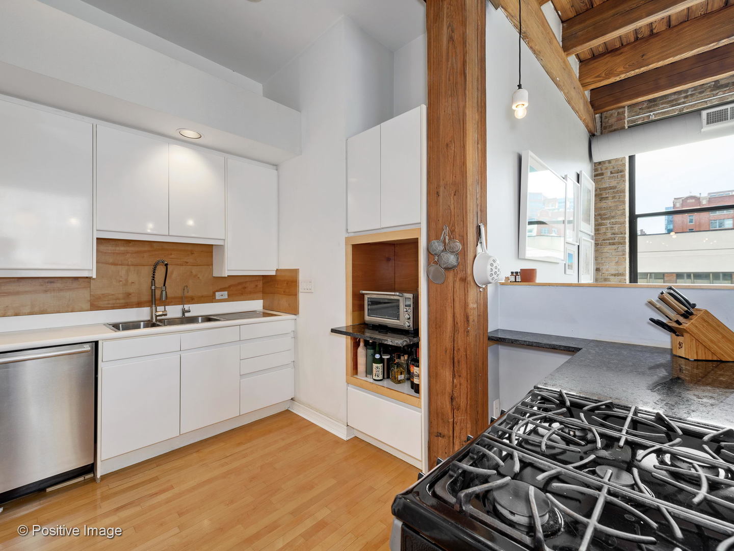 11 North Green Street, Unit 3CD Chicago, IL 60607 - Photo 29 of 40 a kitchen with stainless steel appliances a stove a sink and a refrigerator