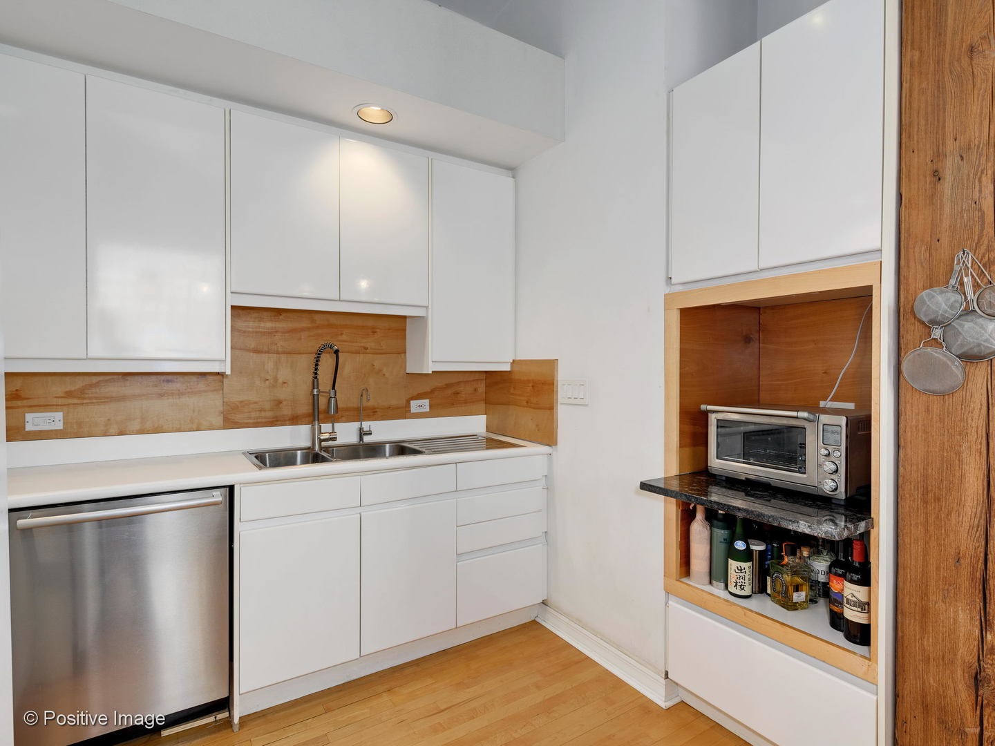 11 North Green Street, Unit 3CD Chicago, IL 60607 - Photo 30 of 40 a kitchen with stainless steel appliances a sink stove and cabinets