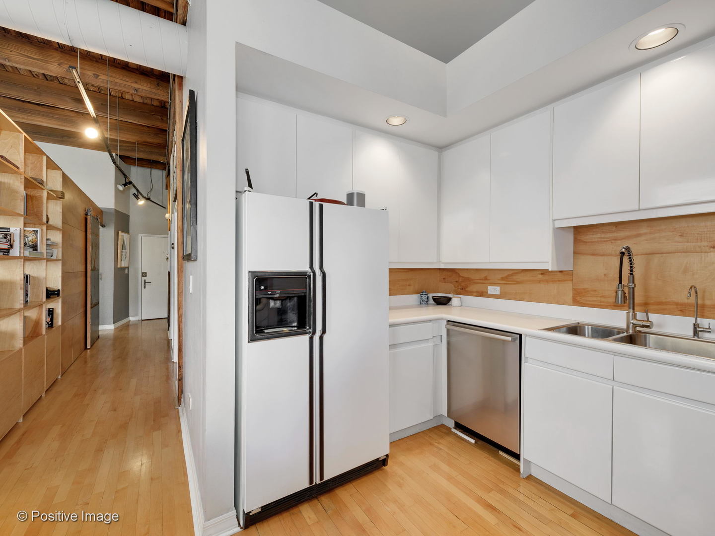 11 North Green Street, Unit 3CD Chicago, IL 60607 - Photo 31 of 40 a kitchen with stainless steel appliances a refrigerator and a sink