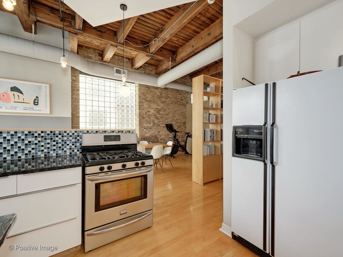 11 North Green Street, Unit 3CD Chicago, IL 60607 - Photo 32 of 40 a kitchen with stainless steel appliances granite countertop a stove and a refrigerator