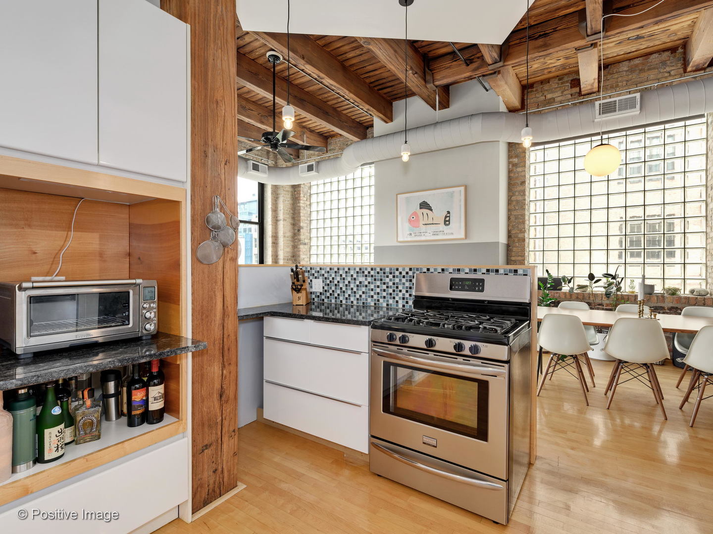 11 North Green Street, Unit 3CD Chicago, IL 60607 - Photo 33 of 40 a kitchen with stainless steel appliances granite countertop a stove and a microwave