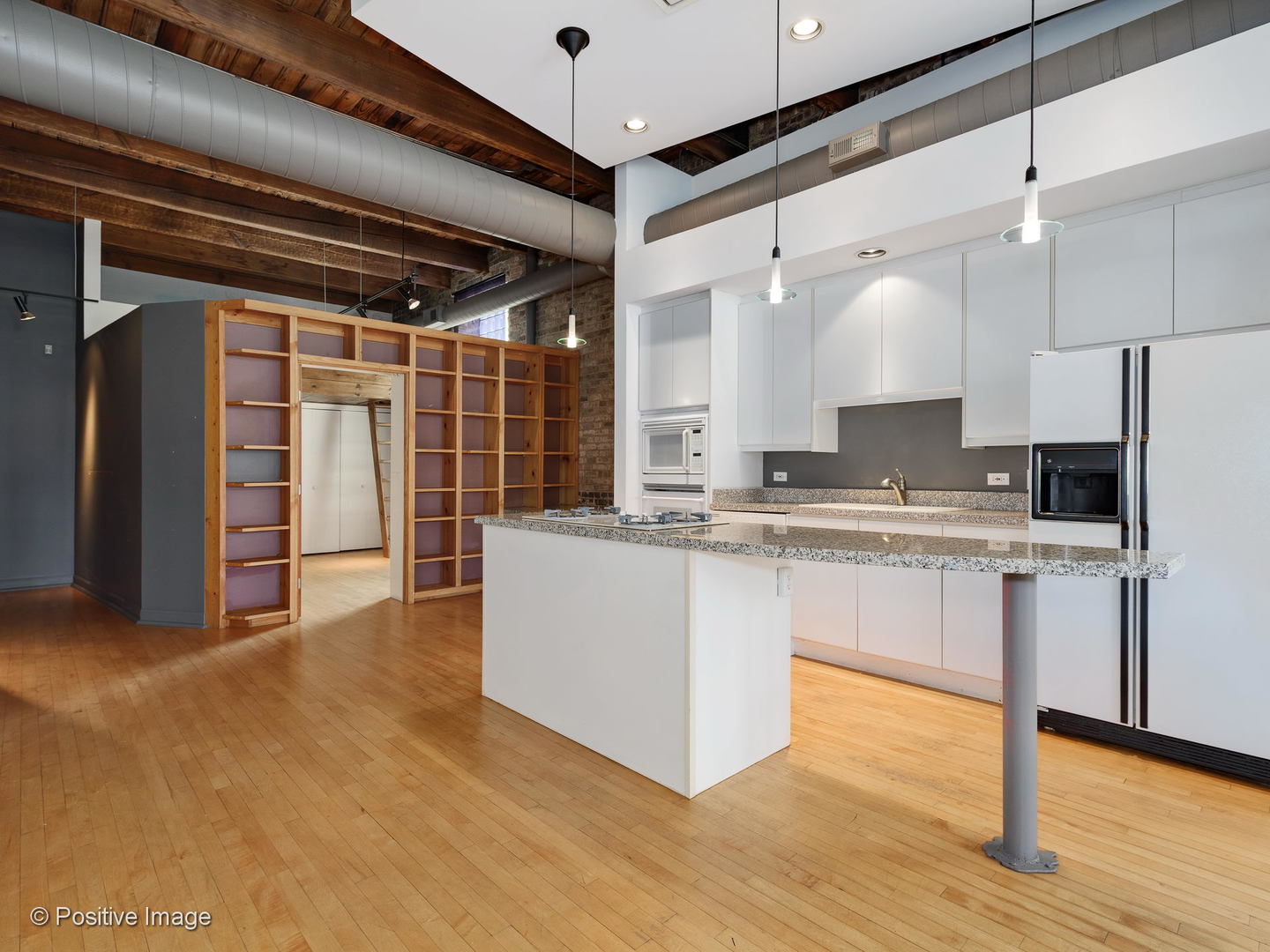 11 North Green Street, Unit 3CD Chicago, IL 60607 - Photo 6 of 40 a kitchen with stainless steel appliances granite countertop a refrigerator and a stove top oven